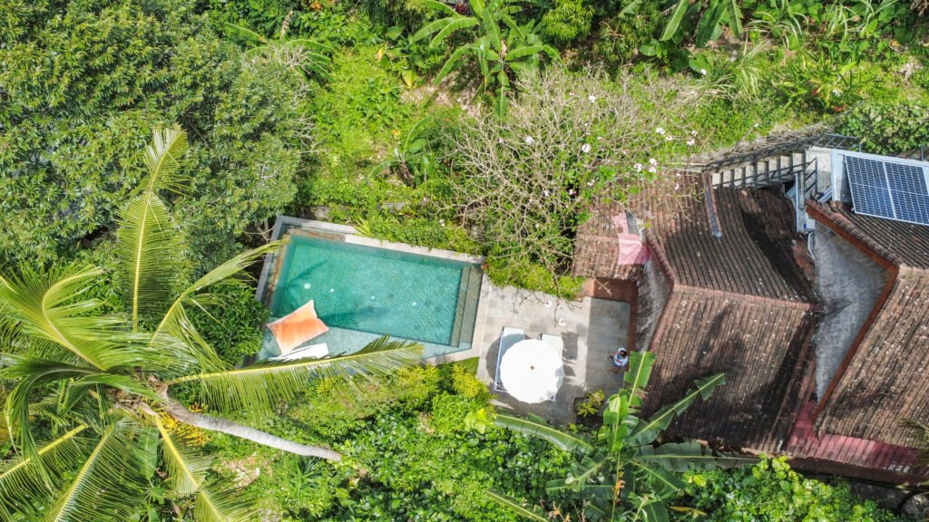 Aerial view of Samastiti Ubud Villa with private pool surrounded by lush jungle.